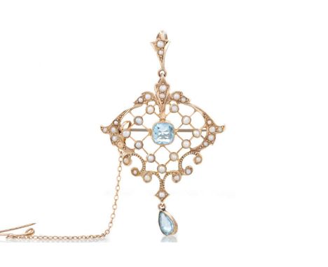 EDWARDIAN TOPAZ AND SEED PEARL HOLBEIN set with cushion cut topaz to an openwork seed pearl mount, with pear shaped topaz dro