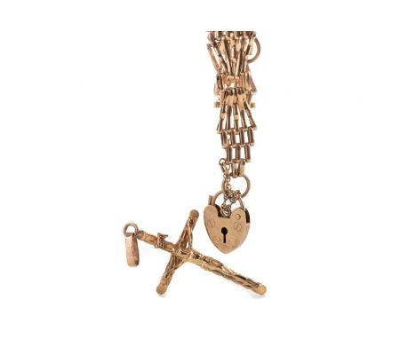 GATE BRACELET ALONG WITH A CRUCIFIX PENDANT both in nine carat gold, the bracelet with fan shaped links and a padlock clasp Q