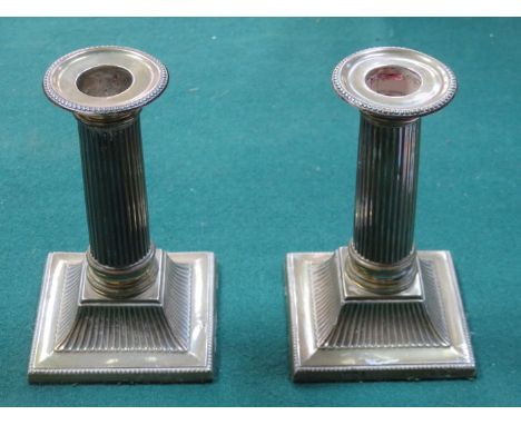 SMALL PAIR OF COLUMN FORM HALLMARKED SILVER CANDLESTICKS, SHEFFIELD ASSAY, APPROXIMATELY 31cm HIGH