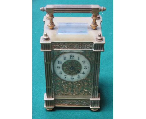 ORNATELY DECORATIVE BRASS AND GLASS CASED FRENCH STYLE CARRIAGE CLOCK 
