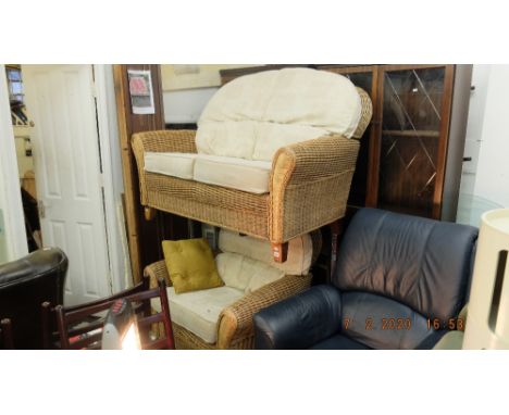 A rattan sofa and armchair