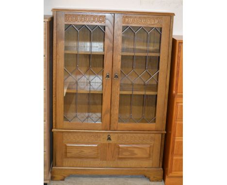 OAK DOUBLE DOOR BOOKCASE WITH PRESS BENEATH    