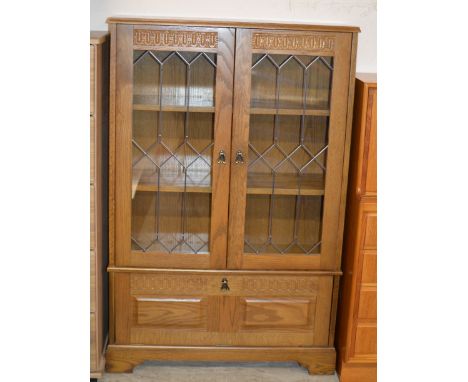 OAK DOUBLE DOOR BOOKCASE WITH PRESS BENEATH    