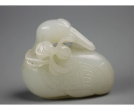 A Chinese white Jade carving of a seated goose/Mandarin duck with peach blooms, 5cm wide    CONDITION REPORT:  See further im