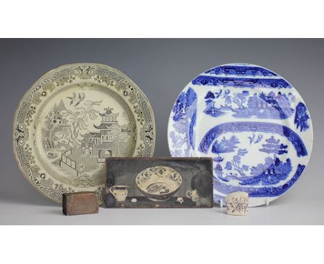 A willow pattern circular trial plate, transfer printed in blue with willow pattern meat plate trials, 24.5cm diameter, a Bur