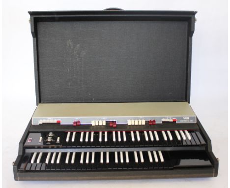 A Vox Continental 300 electric organ, in hardwood travelling case, with folding stand (Not tested - sold as a decorative item