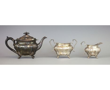 A Victorian silver three piece bachelor tea service, Albert Henry Thompson, Sheffield 1901, comprising; a teapot with ebonise