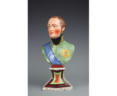 An early 19th century Staffordshire pearl ware bust of Tsar Alexander I, modelled in military uniform, set on a waisted faux 