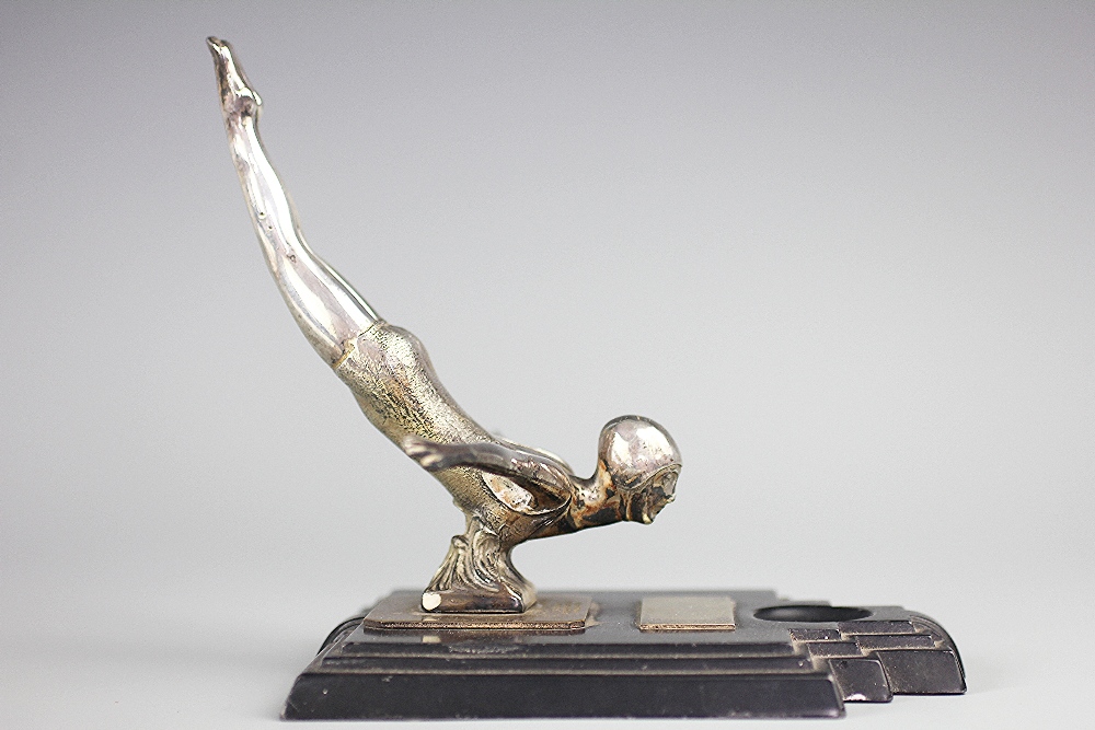 An Art Deco Art Metal Works 'Female Bather Diving' sculpture, dated