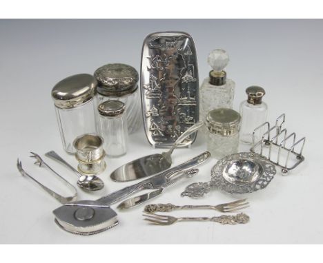 A collection of silver and white metal wares, to include; a Dutch silver straining spoon, a navette shaped white metal snuff 