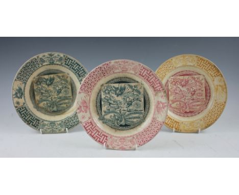 Three pieces of Glasgow Pottery, J & M.P. Bell & Co Ltd, 'Peacock & Lilies' pattern, comprising; two plates, 24cm diameter wi