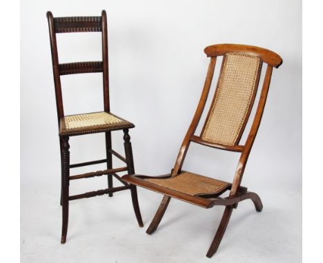 A late Victorian beech high back chair / correction chair, with caned seat and bobbin detailing, 99cm H, with a folding beech