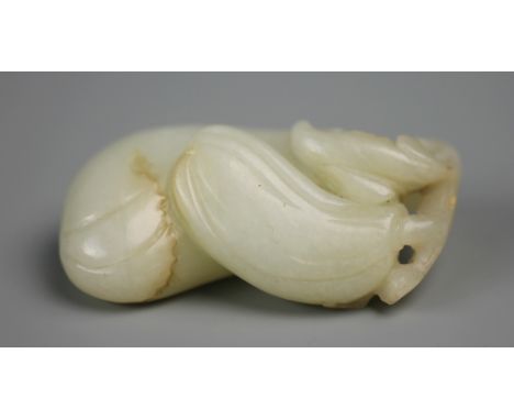 A Chinese light celadon Jade carving of a double peach descending from a stem, 5cm high 