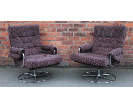 A pair of 1970's Retro swivel office chairs, with button back upholstery, on tubular metal frames. (2) These chairs are offer