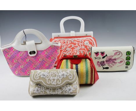 Three Lulu Guiness London handbags comprising; a Mini Paula type paper straw hatched example with floral lined interior, a ve
