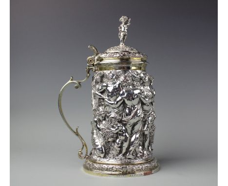 A 19th century Elkington Mason & Co silver plated tankard, decorated with a continuous bacchanalian scene, underside inscribe