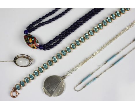 A collection of jewellery, to include; an Art Deco circular locket and attached chain, an enamelled chain, a cabochon set bro