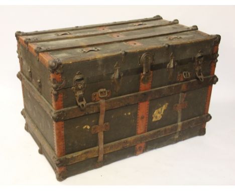 An Emergency Trunk and Bag Co steamer trunk, wood and metal bound with canvas covering, 64cm H x 98cm W x 57cm D