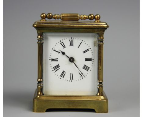 A late 19th century French brass carriage time piece, Roman numeral enamel dial, 10cm handle down   CONDITION REPORT:  The cl