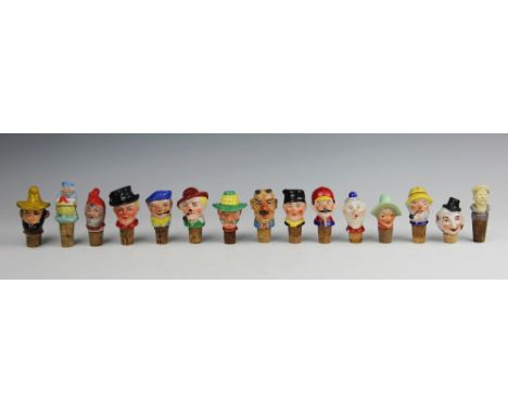 A large collection of novelty ceramic bottle corks/stops, including male and female heads, animals, clowns and erotic example