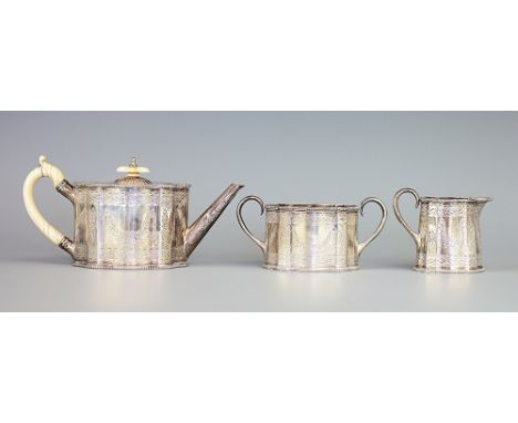 A Victorian silver three piece bachelor tea service, Robert Harper, London 1877, comprising a teapot with ivory handle and fi