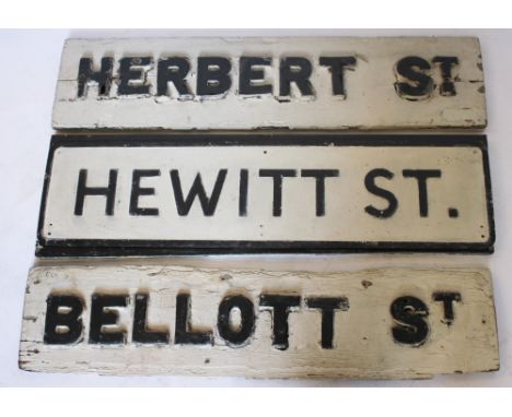 Two Victorian painted pine and iron Manchester street signs, one for 'Herbert St' the other for 'Bellott Street', 91cm, with 