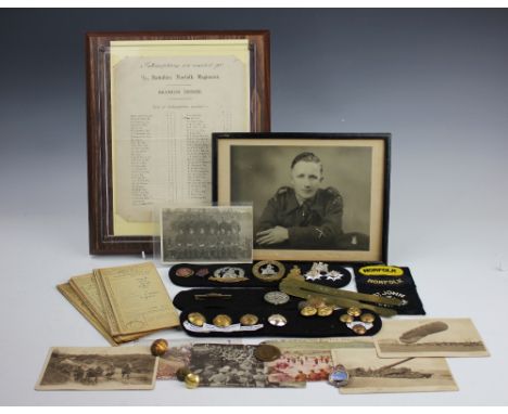 Norfolk Regiment; a collection of Military ephemera, World War I and later, to include three cap badges, eight buttons, other