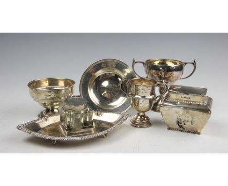 A selection of silver comprising; an Edwardian silver navette shaped desk stand, Samuel M Levi, Birmingham 1902, with integra