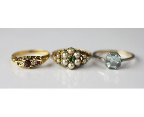 A Victorian emerald and pearl set flower cluster ring, with vacant locket back, set in 18ct yellow gold, a ruby and diamond f