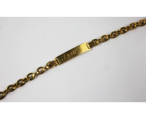 A gold baby's or identity bracelet engraved 'Janet' with attached decorative chain strap and bolt ring clasp, stamped '750', 