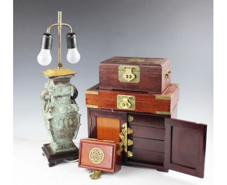 A selection of oriental wares to include a Chinese archaic bronzed lamp base, with two swing handles upon a wooded plinth bas