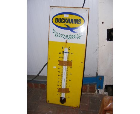 An original Duckhams enamel sign with central thermometer  CONDITION REPORT Height, 91.5cmWidth, 33cmThermometer broken