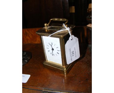A miniature brass cased carriage clock - 8cms high
