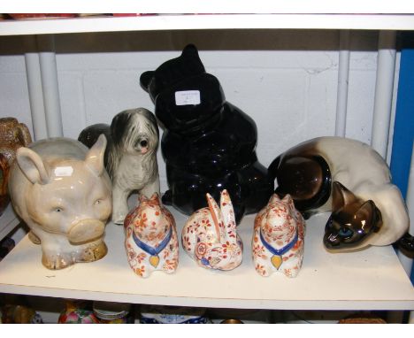 A ceramic cat ornament, rabbits etc.