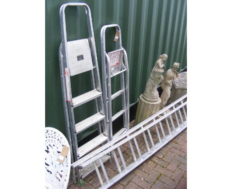 Two aluminium stepladders, together with extending ladder 