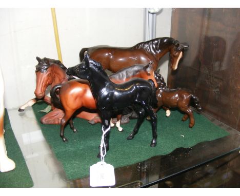 Five ceramic horse ornaments, including Beswick and Royal Doulton 