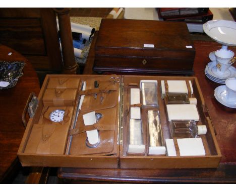 A vintage gentleman's travelling manicure set with clock, together with a wooden travelling box