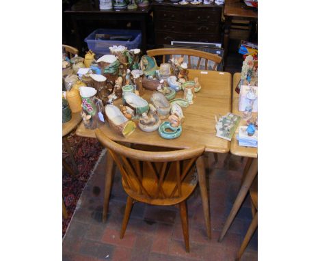 A vintage mid century Blonde Ercol breakfast table with shelf below and two Ercol Model 376 Candlestick dining chairs  