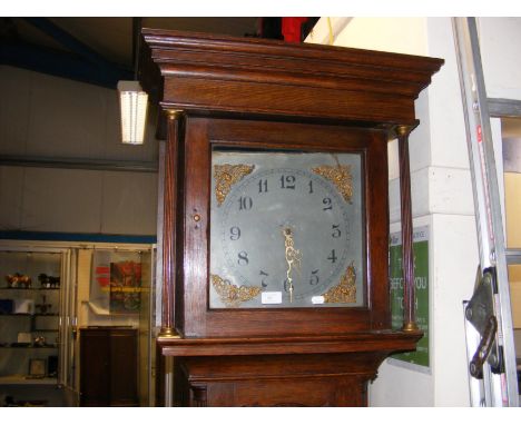A Grandfather clock in oak case with three train movement