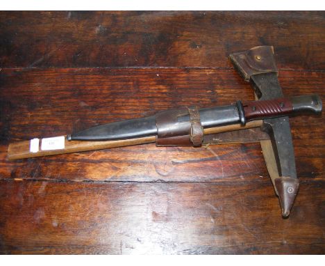 An old K98 bayonet and escape axe in leather sheath (possibly German?) 