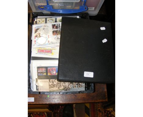 A WWF album of First Day Covers, together with mint stamps in packets, etc. 