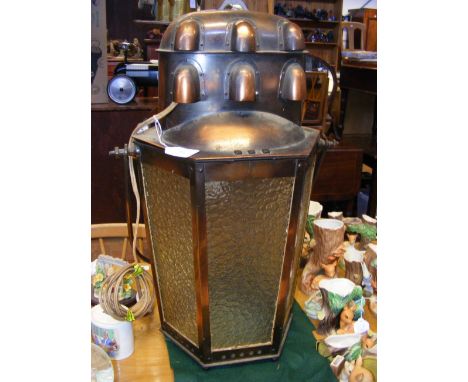 An Arts & Crafts style copper lantern, with six glass panels 