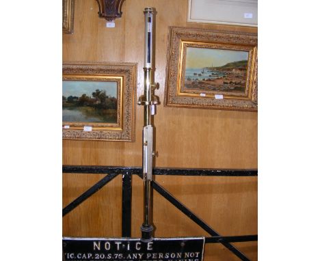 An antique marine stick barometer by G & A Calderara of London, with silvered adjustable barometer correction and original wo