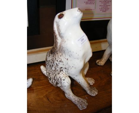 A Winstanley Hare ornament with glass eyes - having signature to base - Size 4 - 27cm high 