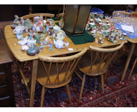A vintage mid century Blonde Ercol dining table with four Ercol Model 376 Candlestick dining chairs  CONDITION REPORT Our tea