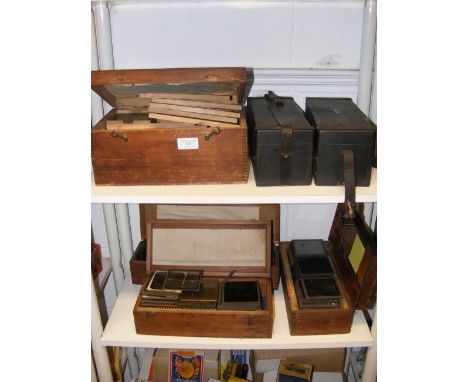 Two shelves of collectable Victorian magic lantern slides - various subjects