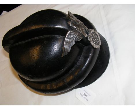 A German WWII 'NSKK' leather motorcycle helmet with silver Imperial badge, stamped 'Property of SS Motorsturme' CONDITION REP