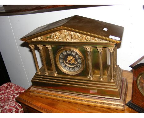 A Victorian brass mantel clock on wooden stand CONDITION REPORT Pendulum included.Key not included.