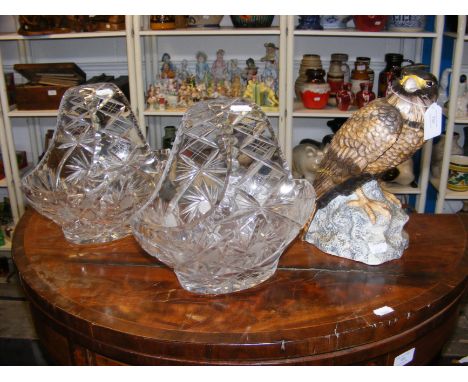 A ceramic bird of brey together with two cut glass fruit bowls