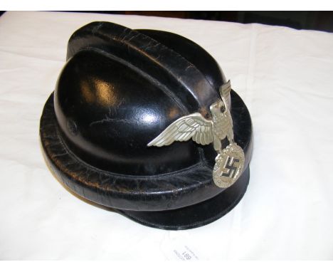 A German WWII NSKK leather motorcycle helmet with eagle motif CONDITION REPORT Our team of trusted experts are on hand to hel
